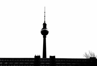 Low angle view of communications tower against clear sky