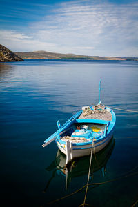 High angle view of boats moored in lake against sky