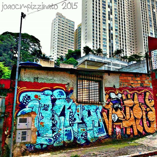 building exterior, architecture, built structure, graffiti, city, building, residential structure, window, residential building, multi colored, wall - building feature, day, brick wall, outdoors, art, text, house, art and craft, street, creativity