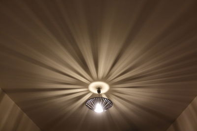 Low angle view of illuminated ceiling