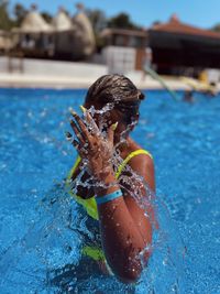 Young woman swimming in pool