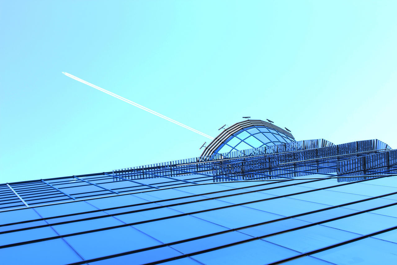 LOW ANGLE VIEW OF MODERN BUILDINGS AGAINST BLUE SKY