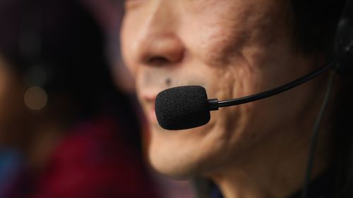 Close-up of man holding microphone