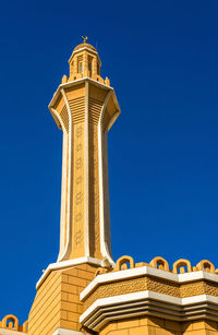 Low angle view of historical building against clear blue sky