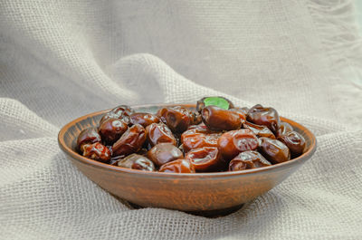 Close-up of food in bowl on jute