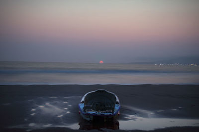 Scenic view of sea against sky at sunset