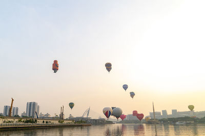 Low angle view of hot air balloons flying in sky