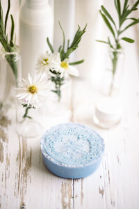 Close-up of white roses in vase on table