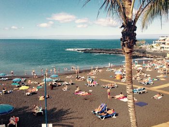 High angle view of people on beach against sky