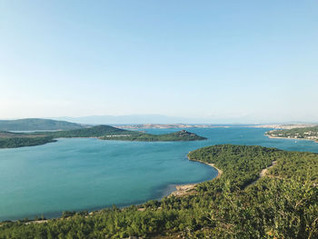 Scenic view of bay against clear sky