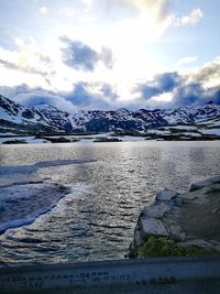 Scenic view of frozen lake against sky