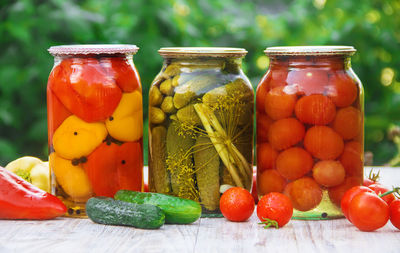 Close-up of fruits in jars on table