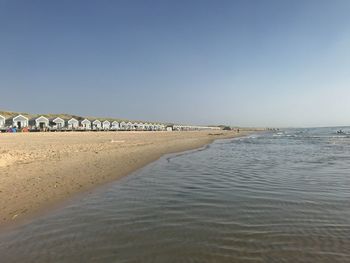 Scenic view of beach against clear sky