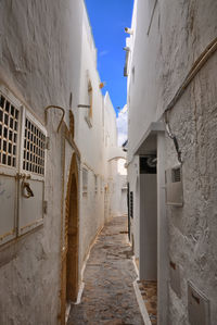 Narrow alley amidst buildings in town