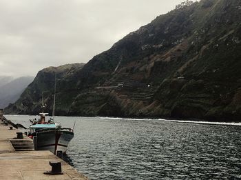 Scenic view of sea against mountains