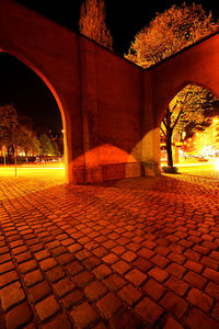 View of illuminated footpath