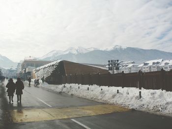 Scenic view of snow covered mountains against sky