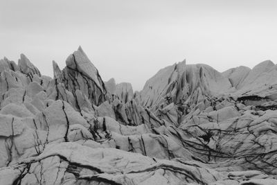 Panoramic view of mountains against clear sky