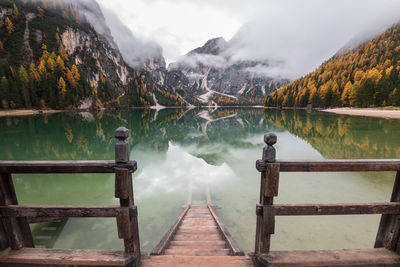 Pier over lake against sky