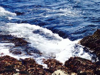 Waves splashing on rocks