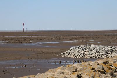 Scenic view of beach against clear sky