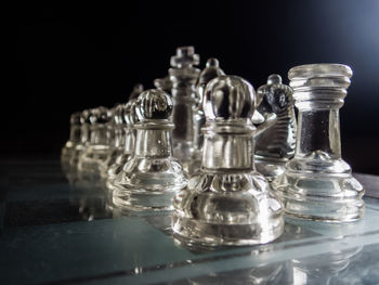 Close-up of chess pieces arranged on board