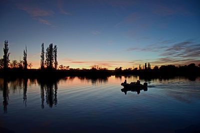 Rear view of man standing in water