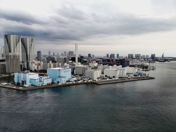 City by sea against sky