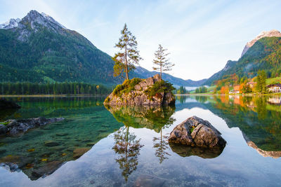 Scenic view of lake and mountains against sky