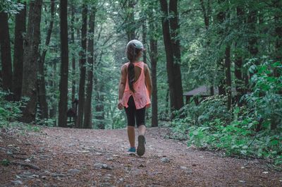 Rear view of woman in forest