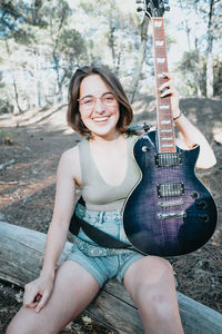 Young woman playing guitar