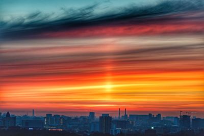 Cityscape against sky during sunset