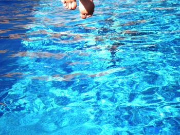 Low section of people in swimming pool