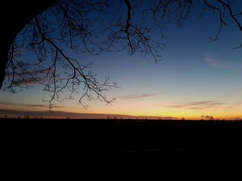 Silhouette landscape against sky during sunset