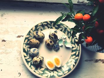 High angle view of eggs in plate on table