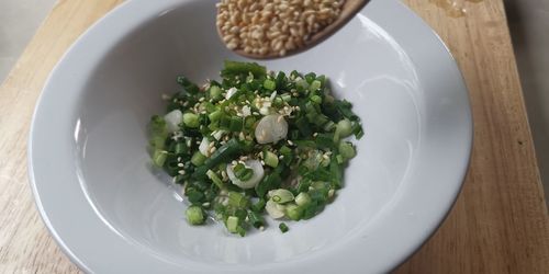 High angle view of vegetables in plate on table