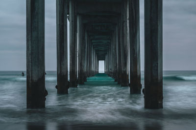 Pier over sea against sky