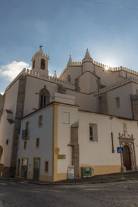 Low angle view of church against sky, evora, portugal