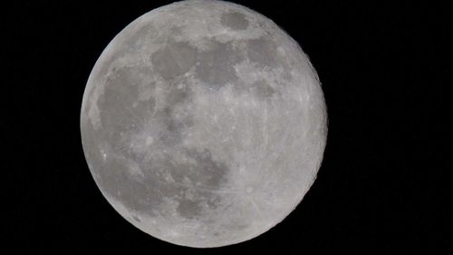 Scenic view of moon against sky at night