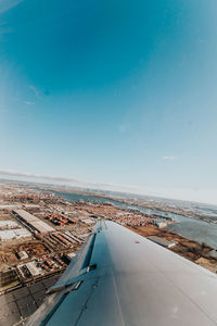 High angle view of airport runway against blue sky