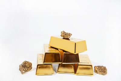 Close-up of chocolate cake in box against white background