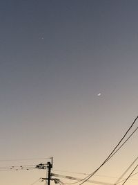 Low angle view of silhouette moon against sky