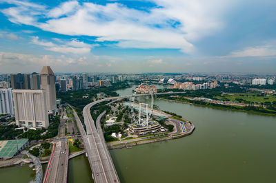 High angle view of bridge and buildings against sky