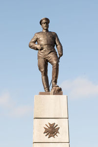 Low angle view of statue against sky