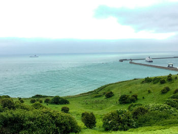 Scenic view of bay against sky