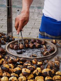 Midsection of man preparing food