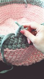 Cropped image of hand knitting