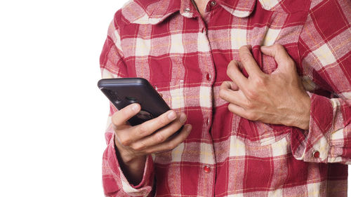 Midsection of woman holding mobile phone