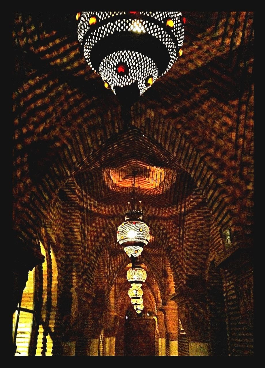 transfer print, indoors, illuminated, auto post production filter, lighting equipment, ceiling, pattern, low angle view, decoration, design, hanging, chandelier, built structure, architecture, ornate, no people, night, religion, spirituality, place of worship