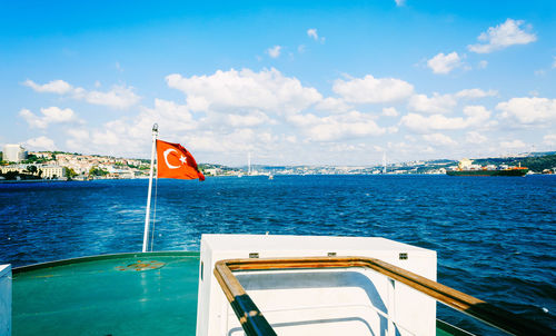 Boat on sea against blue sky